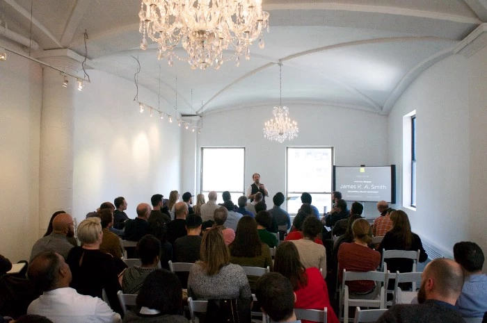 Speaker and audience in conference room