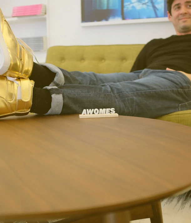 man relaxing in gold shoes