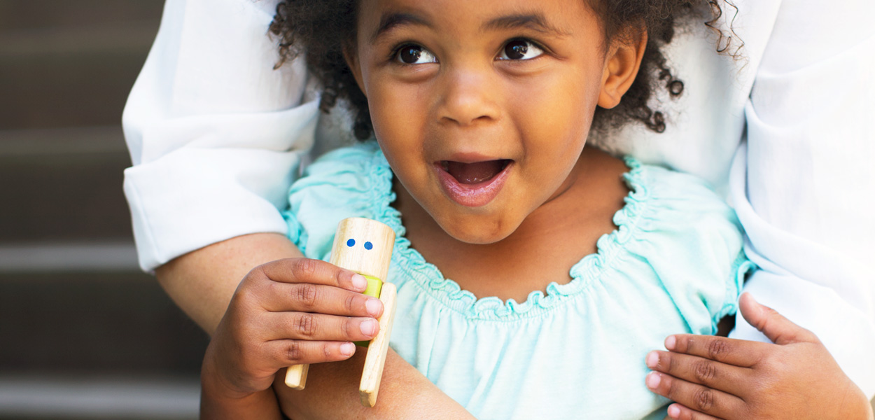 young girl with toy