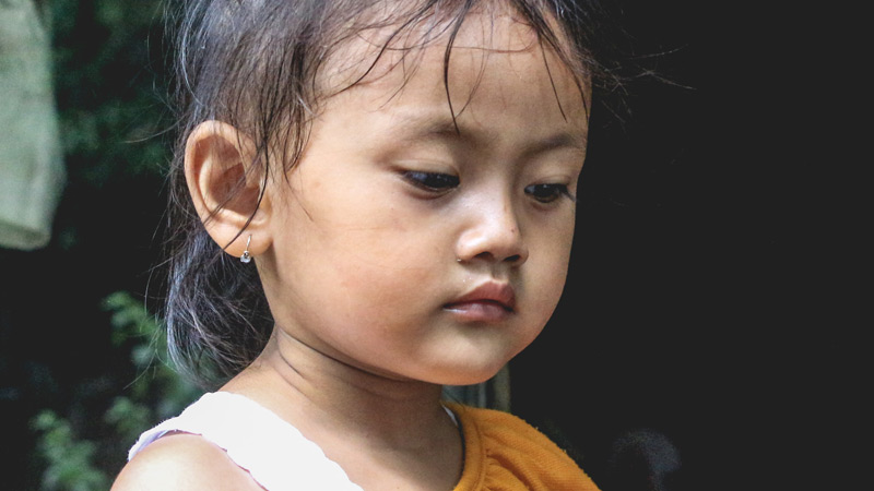 young girl in gold top