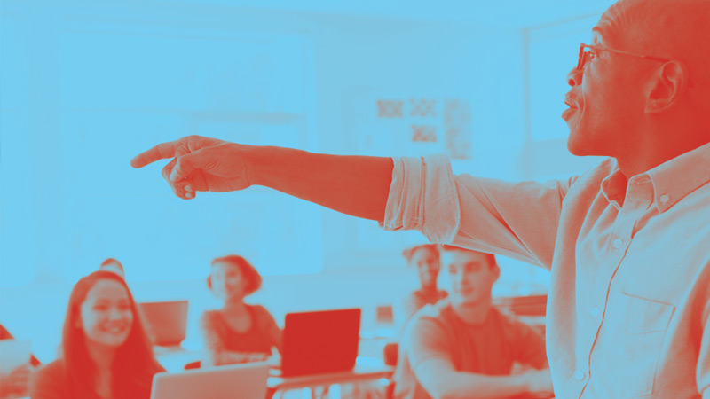 man pointing in classroom